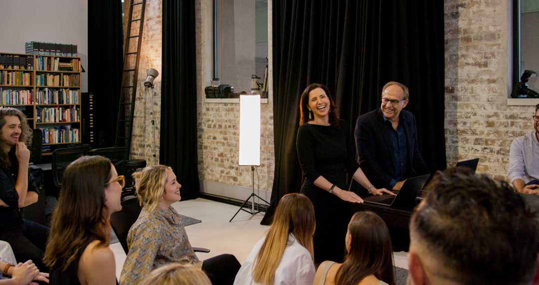 Photo of a collaborative discussion at The Being Group offices.